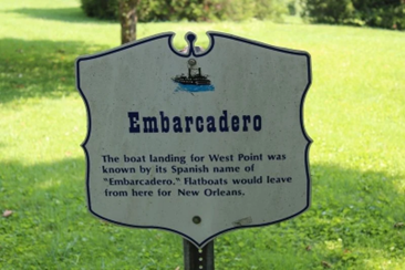 Historic marker describing the Embarcadero, West Point’s early river landing used by flatboats traveling to New Orleans.