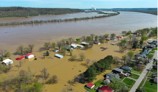 Modern-era photograph of West Point, Kentucky underwater, showing flooded streets and homes during a recent high-water event.