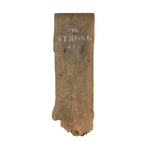 Simple wooden grave marker in grayscale